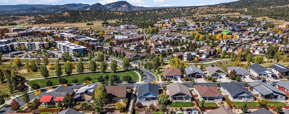 Aerial view of Three Springs single-family homes for sale in Durango, Colorado, with mountain backdrop